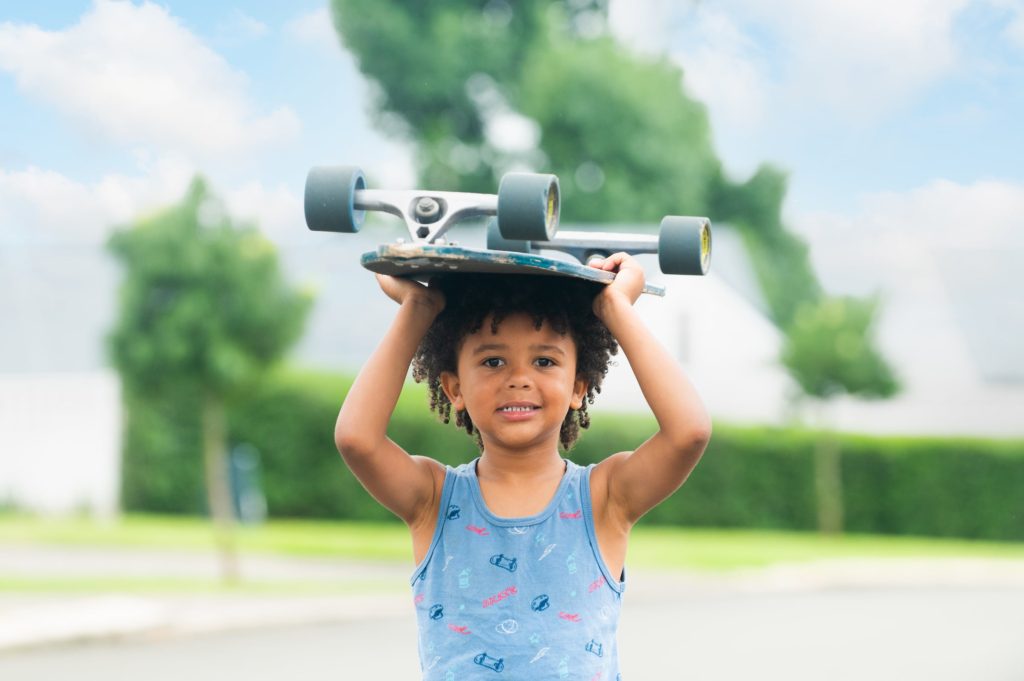 happy child with a skateboard